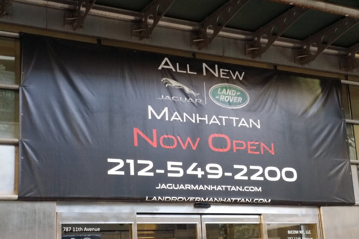 Automotive dealership vinyl banner installation